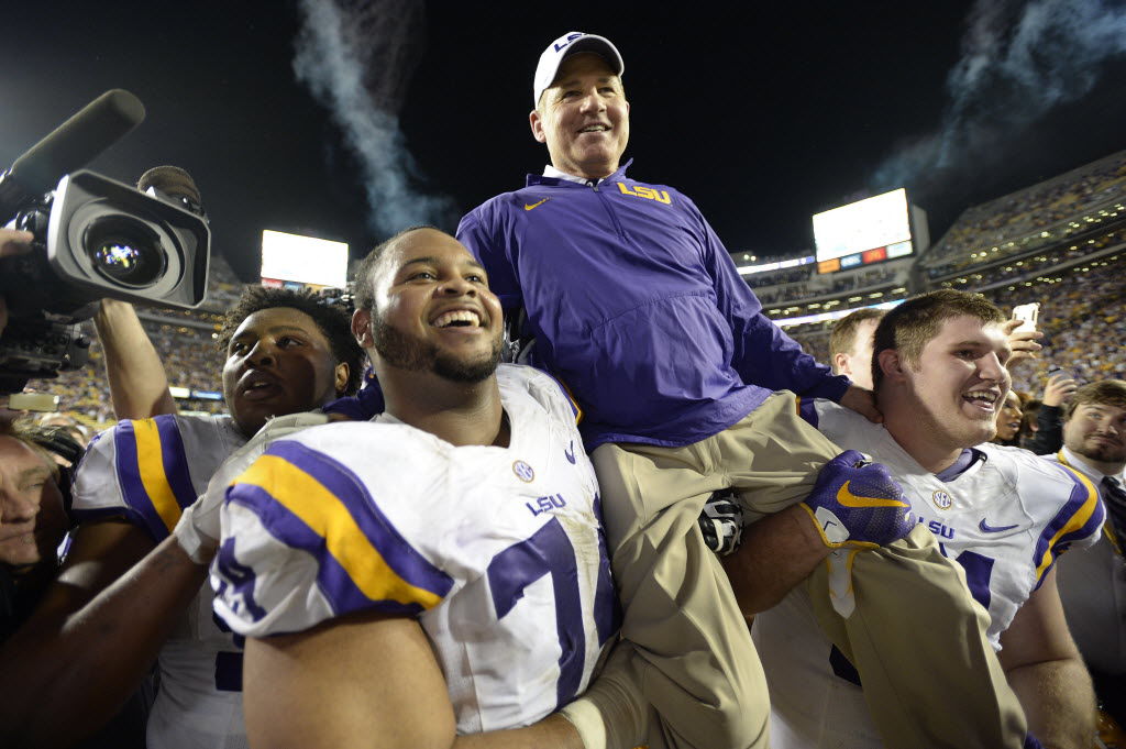 Les Miles carried off field in 2015, ultimately keeps job